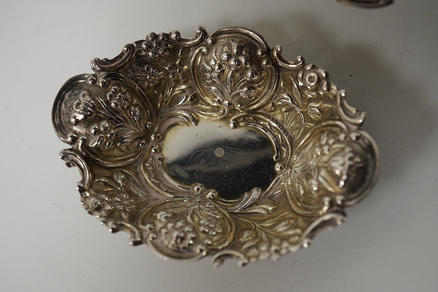 An embossed white metal bon bon dish (a.f.) 11cm and a pair of smaller late Victorian silver bon bon dishes. Condition - poor and good